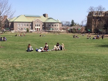 College students relaxing on the grass at Lafayette College.